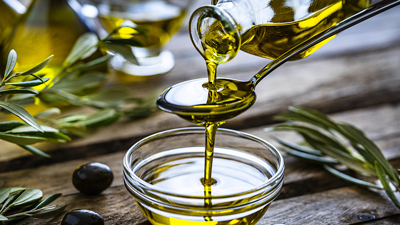 Pouring olive oil into bowl