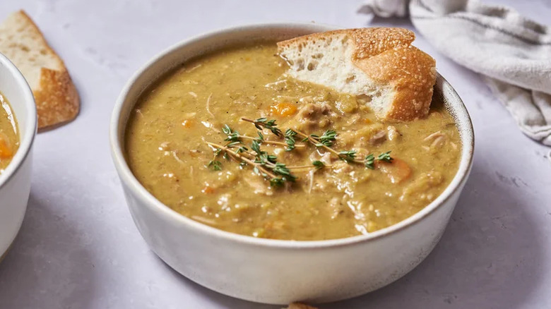 Slow cooker soup with piece of bread