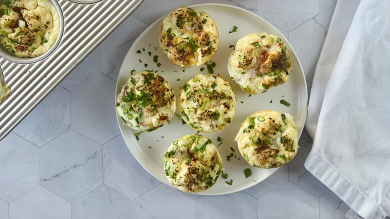 Plate of egg bites with green onions.