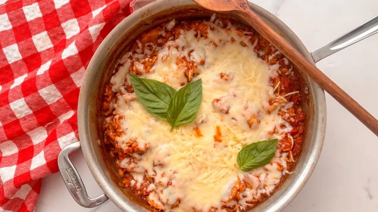 Slow cooker with soup and spoon