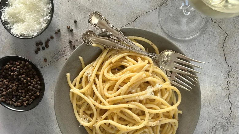 Bowl of bucatini with pepper and Parmesan