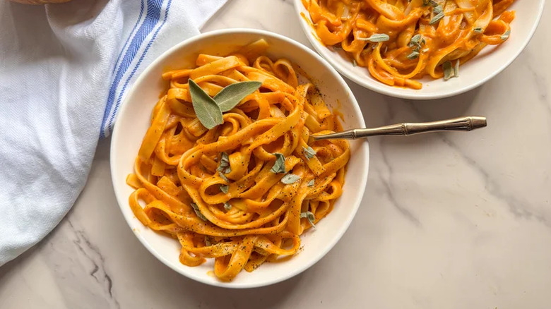 Pumpkin pasta in a bowl with a fork