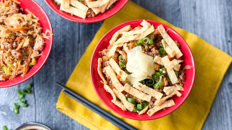 Egg roll in a bowl with chopsticks