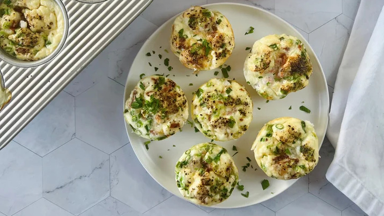 Feta and ham egg bites on a plate