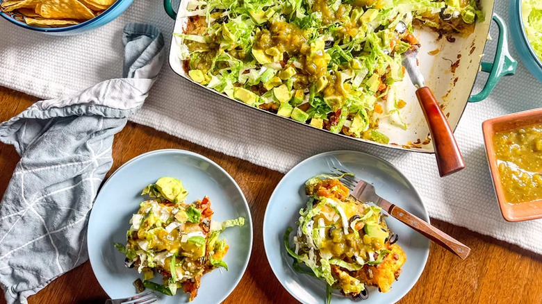 Loaded beef taco casserole with forks on a table