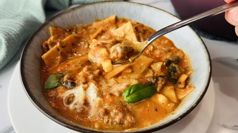 Bowl of soup with meat and pasta