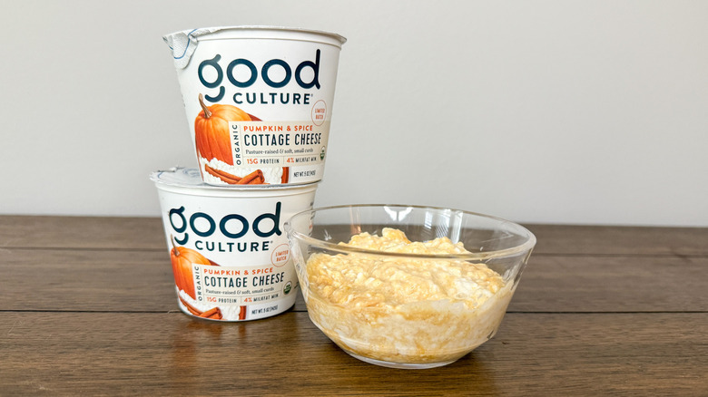 Containers of cottage cheese stacked on one another