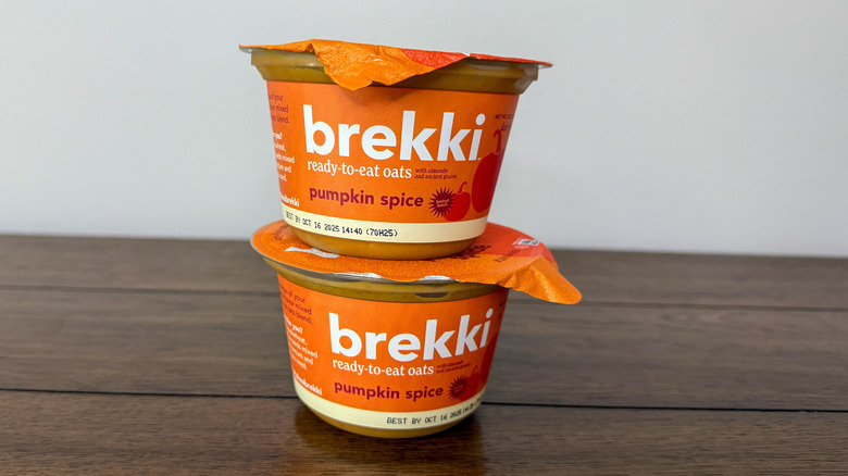 Packages of Brekki pumpkin spice overnight oats stacked on top of each other