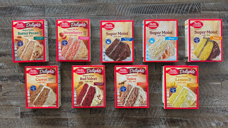 Boxes of cake mix on wooden surface