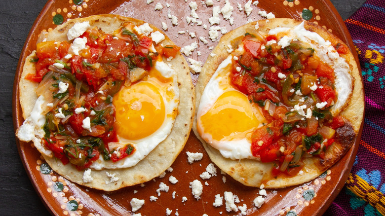 huevos rancheros sprinkled with cheese