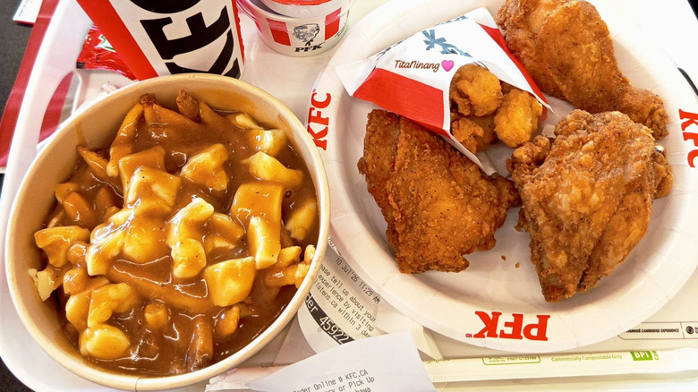 Plate of KFC fried chicken alongside fries with gravy and cheese curds