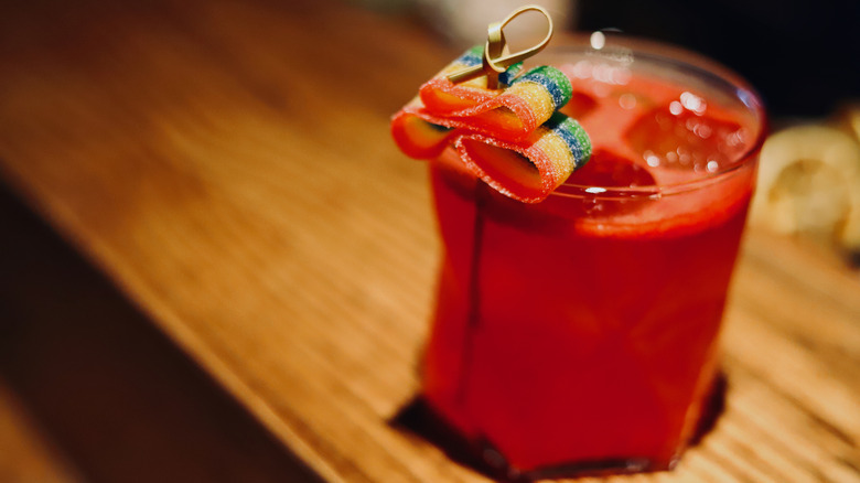 cocktail topped with sour candy strip