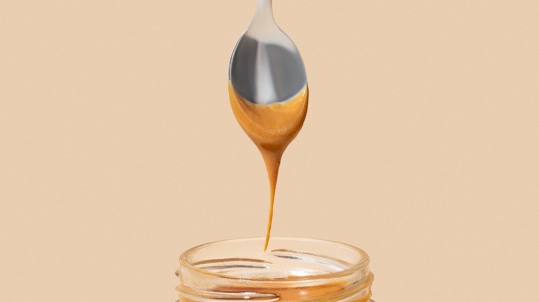 peanut butter syrup on spoon