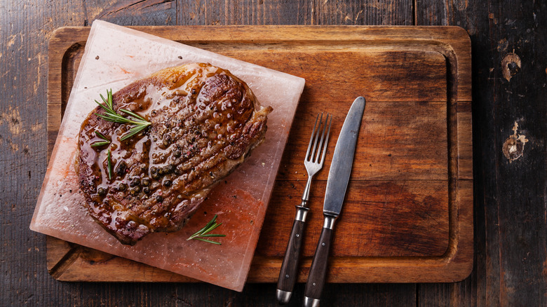 top down view of steak served on salt block