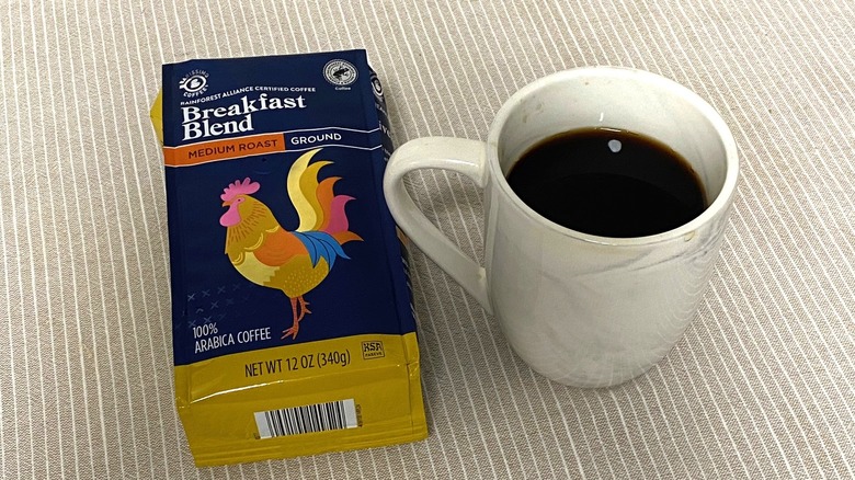 Aldi breakfast blend coffee in bag with a cup of brewed coffee