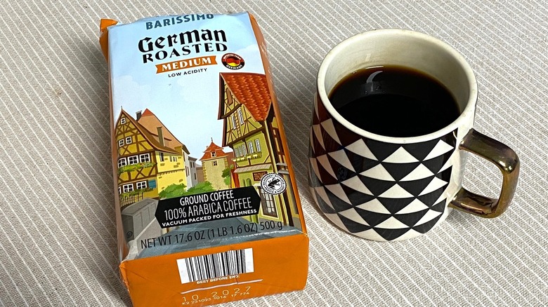 Aldi German roasted coffee in bag with a cup of brewed coffee