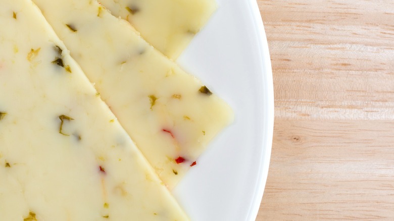 Sliced of pepper jack on a plate