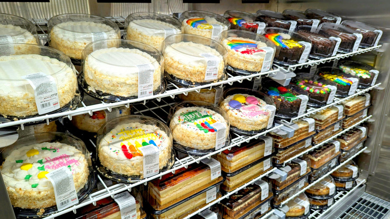 Assortment of Costco cakes organized in a bakery refrigerator