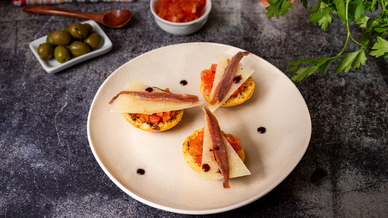 Anchovies on cheese crostini