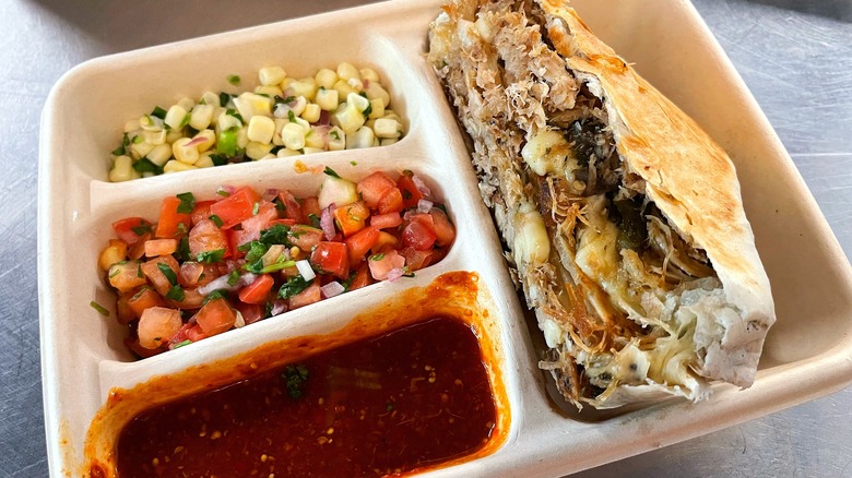 Chipotle's quesadilla with large sides of corn, salsa, and pico de gallo