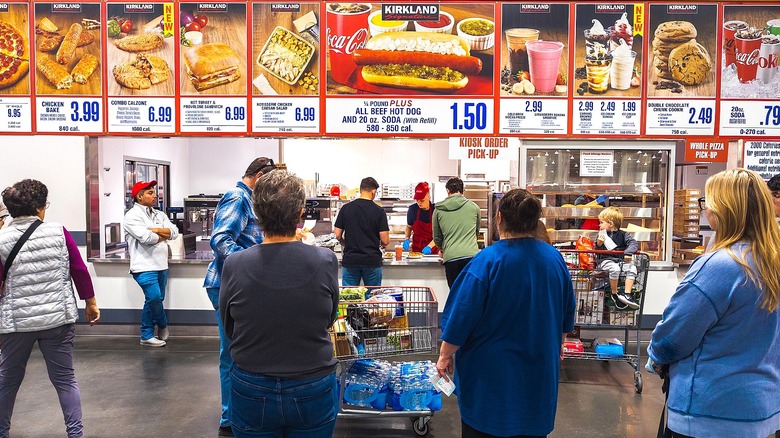 People in line at a Costco food court