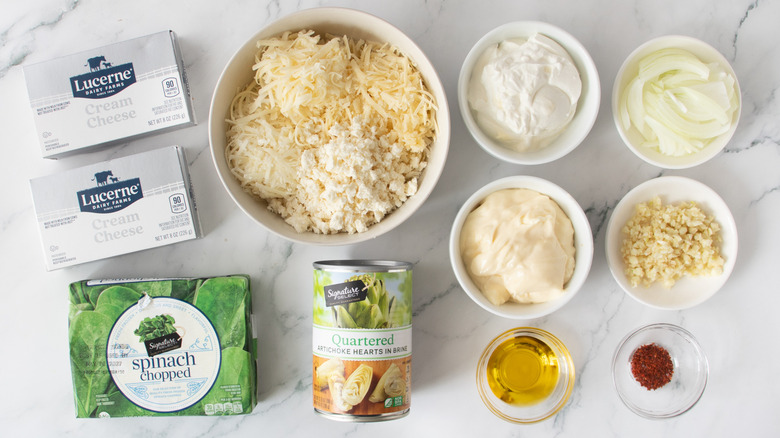 cheeses, spinach, canned artichokes and other ingredients