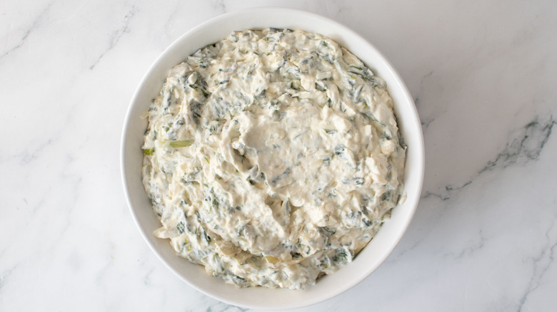 cheese dip in a round white pan