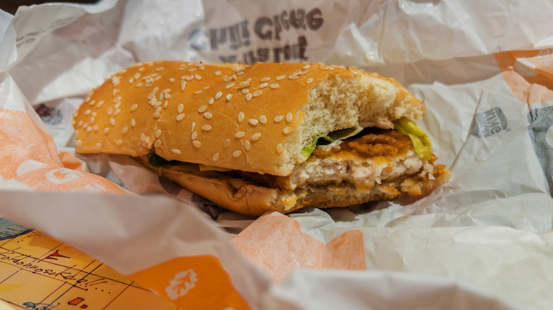 Burger King's Original Chicken Sandwich with a bite taken from it