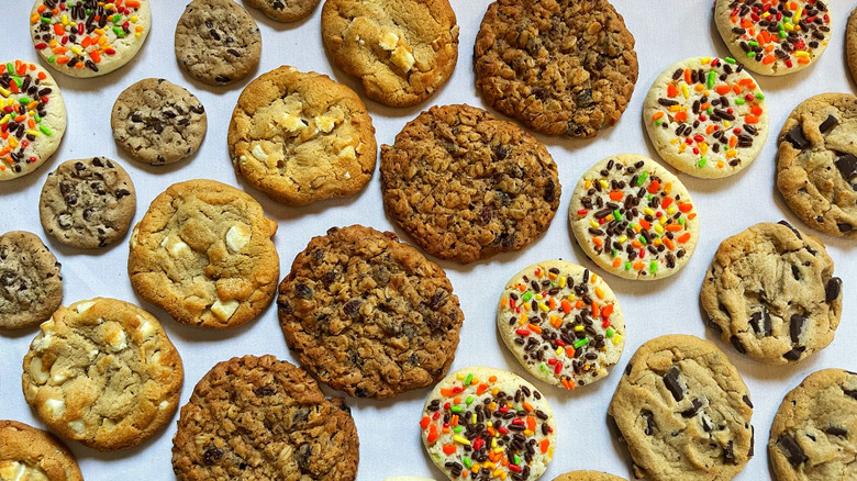 5 different kinds of Costco cookies arranged in straight lines on a white background