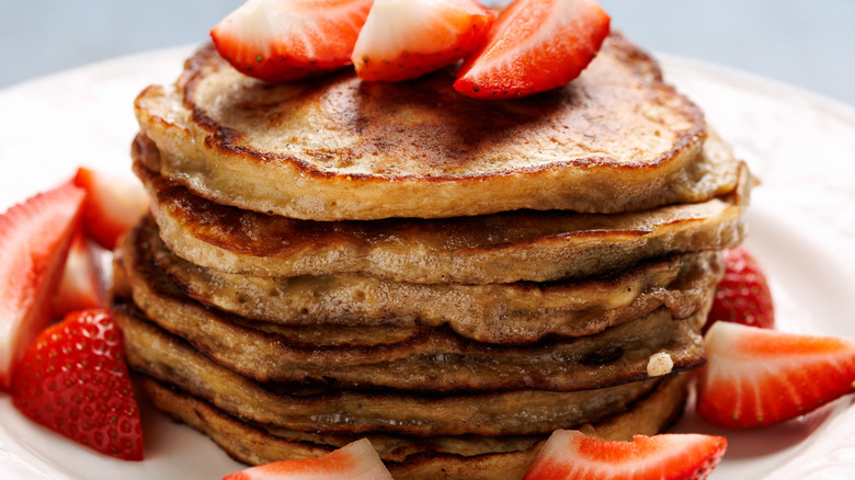 Stack of pancakes with strawberries