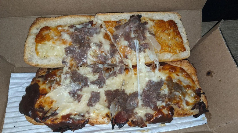 A Domino's philly cheesesteak in a box