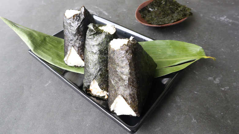 Wrapped onigiri served on plate