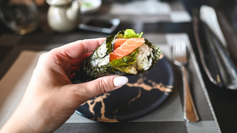 Diner enjoying temaki in restaurant