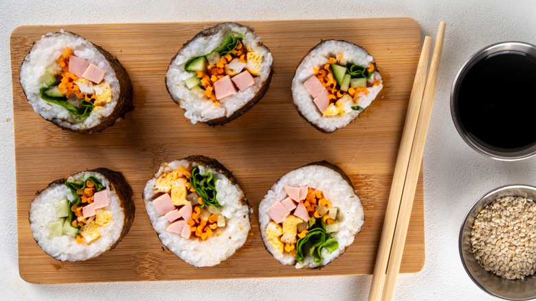 Sliced kimbap displayed on cutting board