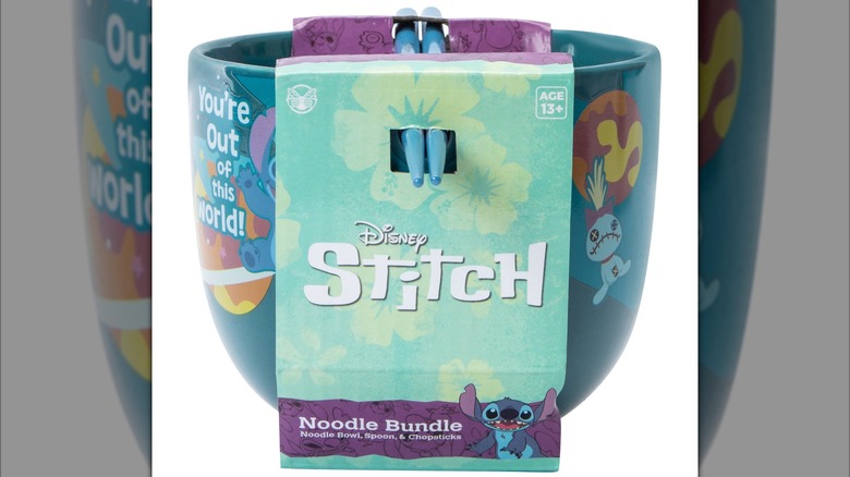 A teal-colored bowl with a Stitch-inspired design.