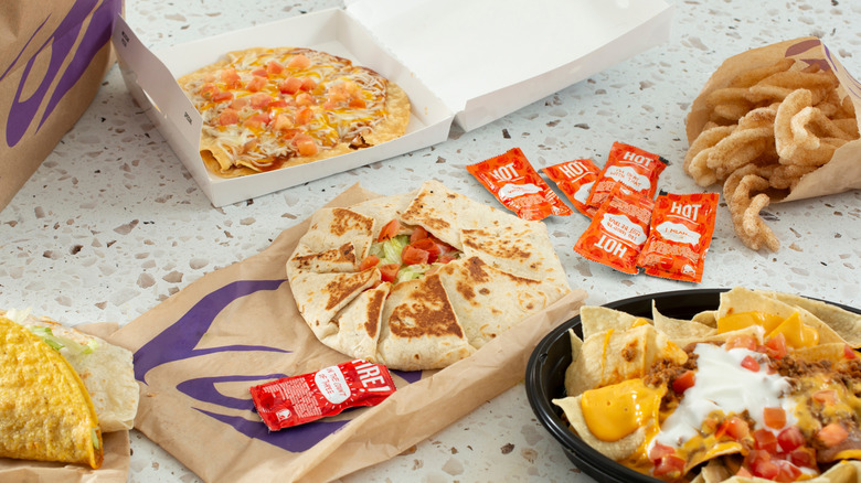 Taco Bell's Mexican Pizza, nachos, cinnamon twists, Crunchwrap Supreme, and hot sauces