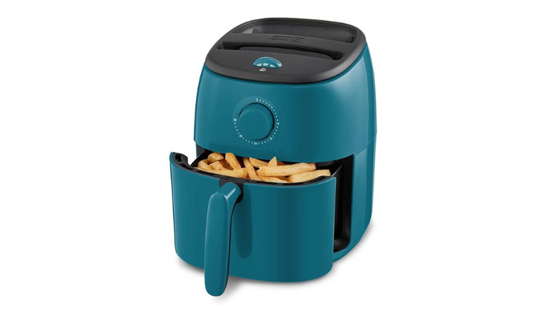 Blue DASH Tasti-Crisp™ Electric Air Fryer Oven on white background with French fries in the basket.