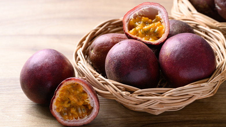 Passion fruit in and around a basket