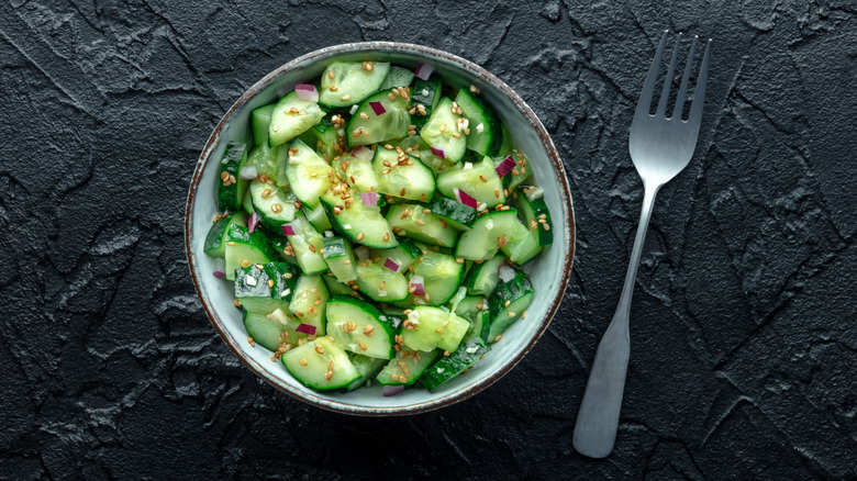 Cucumber salad in a bowl photographed from above.