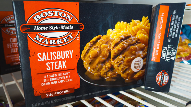 A Boston Market frozen meal on a grocery store freezer shelf