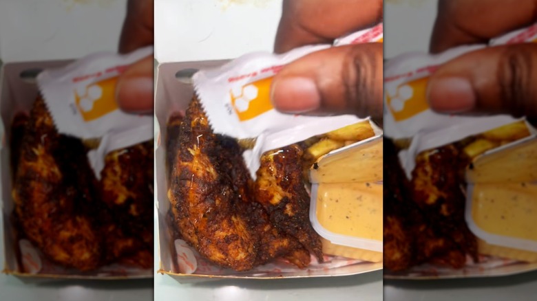 Image of honey drizzle on blackened Popeyes tenders