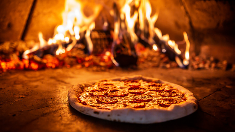 pepperoni pizza in wood fired oven