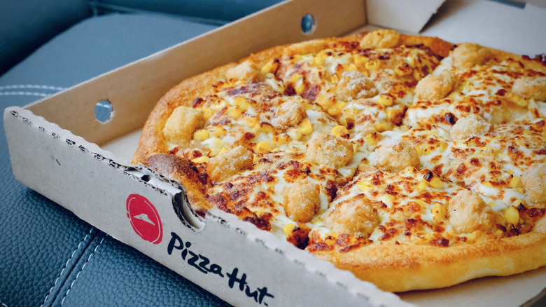 open Pizza Hut box with pizza inside