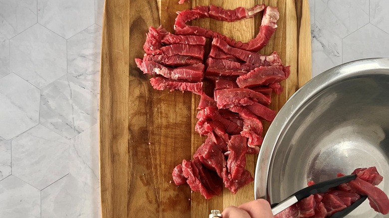 raw steak slices and bowl