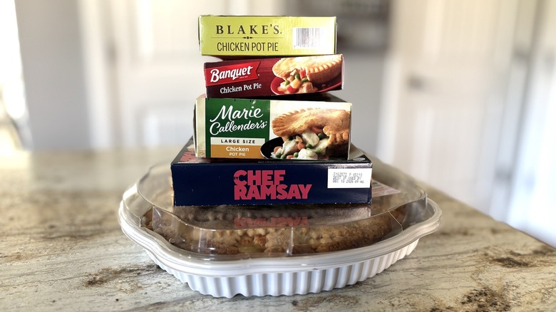 stack of store-bought chicken pot pies on counter