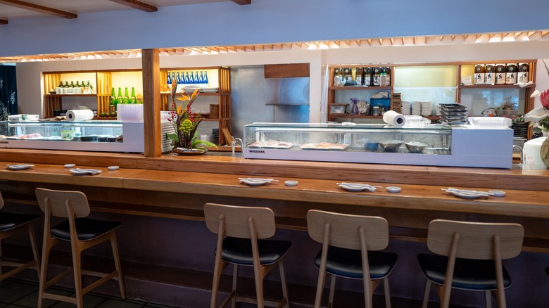 Seats at sushi bar