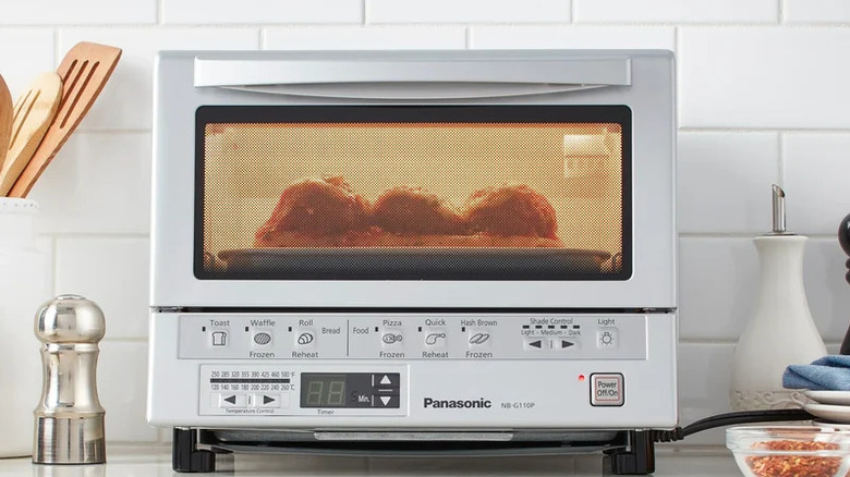 Food being toasted in the Panasonic FlashXpress Toaster Oven, 1300W
