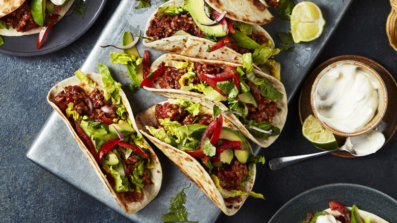 Tacos with fixings and sauces