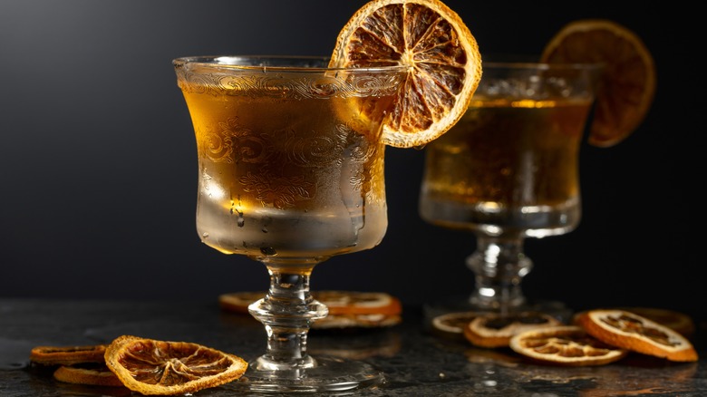 Rum cocktail garnished with a dehydrated orange wheel