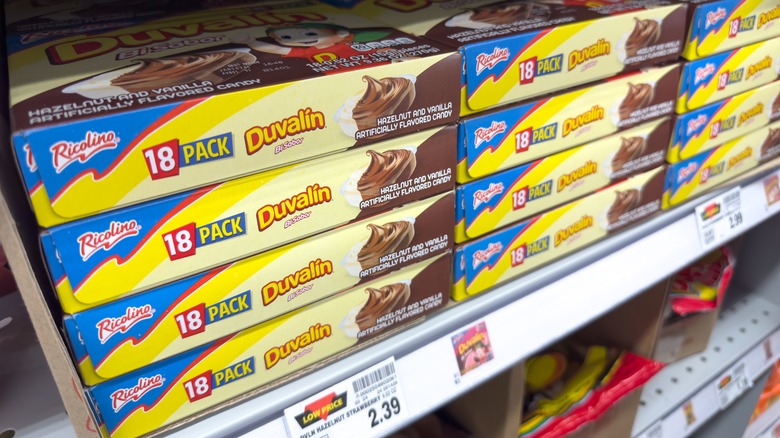 Packages of Duvalin candy on a grocery store shelf.